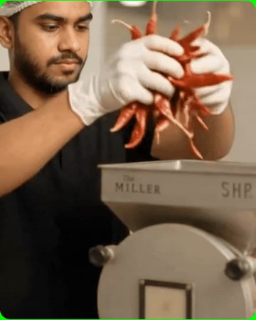 Chilli being milled to powder in front of customers at a Miller Stores counter